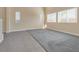 The spacious living room is well lit, and features carpet and tile flooring at 7203 Pepperbox Ave, Las Vegas, NV 89179