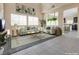 Bright living room featuring neutral colors, large windows, and an open layout for seamless entertaining at 7203 Pepperbox Ave, Las Vegas, NV 89179