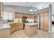 Well-appointed kitchen featuring light wood cabinetry, stainless steel appliances, and tile floors at 7549 Splashing Rock Dr, Las Vegas, NV 89131