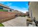 Private backyard featuring brick pavers, artificial turf, and an outdoor dining area perfect for entertaining at 7856 Pyramid Peak St, Las Vegas, NV 89166