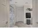 The clean bathroom features tile flooring and a decorative floral shower curtain at 7856 Pyramid Peak St, Las Vegas, NV 89166