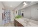 This well lit bathroom features a large mirror and lots of counter space at 7856 Pyramid Peak St, Las Vegas, NV 89166