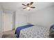 This bedroom features a ceiling fan, closet, and neutral colors at 7856 Pyramid Peak St, Las Vegas, NV 89166