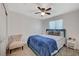 This guest bedroom features a ceiling fan, natural light, and neutral colors at 7856 Pyramid Peak St, Las Vegas, NV 89166