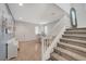 Inviting entryway featuring a staircase, wood-like flooring, and plenty of natural light at 7856 Pyramid Peak St, Las Vegas, NV 89166