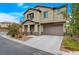 Well-manicured front lawn and charming covered porch enhance the curb appeal of this lovely home at 7856 Pyramid Peak St, Las Vegas, NV 89166