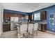 Stylish kitchen with granite countertops, stainless steel appliances, and a dark blue accent wall at 7856 Pyramid Peak St, Las Vegas, NV 89166