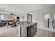 Kitchen island provides bar seating and overlooks the open concept living and dining areas at 7856 Pyramid Peak St, Las Vegas, NV 89166