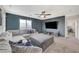 Relaxing living room features large TV, comfortable seating, and views from the window at 7856 Pyramid Peak St, Las Vegas, NV 89166