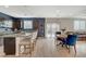 Open concept living area with stainless steel appliances, granite countertops, and modern finishes at 7856 Pyramid Peak St, Las Vegas, NV 89166