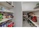 Organized walk-in pantry with ample shelving for storage, keeping your kitchen clutter-free at 7856 Pyramid Peak St, Las Vegas, NV 89166