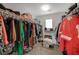 The large walk-in closet is well organized with shelving and clothing rods at 7856 Pyramid Peak St, Las Vegas, NV 89166