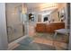Bathroom featuring a glass enclosed shower, soaker tub, and double sink vanity at 916 Echo Beach Ave, North Las Vegas, NV 89086