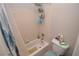 Bathroom with tiled shower/tub combo, curtain, and standard toilet at 916 Echo Beach Ave, North Las Vegas, NV 89086