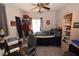 Bedroom with carpeted flooring, an overhead fan, and a closet with hanging clothes at 916 Echo Beach Ave, North Las Vegas, NV 89086