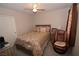 Bedroom with ceiling fan, queen bed, and a chair at 916 Echo Beach Ave, North Las Vegas, NV 89086