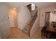 Entryway featuring staircase with wood and iron, tiled floors, and dining area at 916 Echo Beach Ave, North Las Vegas, NV 89086