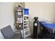 Utility room with hot water tank, water conditioner, ladder, and waste bins at 916 Echo Beach Ave, North Las Vegas, NV 89086