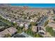 A wide aerial perspective shows a well-planned neighborhood with tidy landscaping and mountain views at 9309 Deer Lodge Ln, Las Vegas, NV 89129