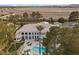 Aerial view of a grand home featuring lush landscaping, a backyard pool, and mature trees at 10 Innisbrook Ave, Las Vegas, NV 89113