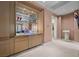 Bedroom wet bar features mirrored cabinets, and a mini refrigerator at 10 Innisbrook Ave, Las Vegas, NV 89113