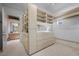 Walk-in closet with custom shelving and drawers, designed for optimal organization and storage, with a door to the bathroom at 10 Innisbrook Ave, Las Vegas, NV 89113