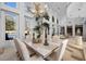 Formal dining room boasting high ceilings, a chandelier, and views of the sparkling pool at 10 Innisbrook Ave, Las Vegas, NV 89113