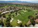 Scenic aerial view of a lush golf course with mature trees and manicured greens at 10 Innisbrook Ave, Las Vegas, NV 89113