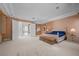 Expansive main bedroom with tray ceilings, large windows, sitting area, and neutral colors at 10 Innisbrook Ave, Las Vegas, NV 89113