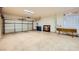 Spacious two-car garage with finished floors and ample lighting at 10013 Arbuckle Dr, Las Vegas, NV 89134