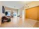 Spacious living room with tile flooring, a fireplace, and sliding glass doors for natural light at 10013 Arbuckle Dr, Las Vegas, NV 89134