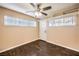 Bright entry room featuring wood-look floors, a ceiling fan, and access to other areas of the home at 1030 Tam O Shanter, Las Vegas, NV 89109