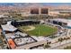 Aerial view showcasing the Las Vegas Ballpark, with views of the city and surrounding mountains at 10448 Niagara Falls Ln, Las Vegas, NV 89144