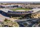 Aerial view showcasing the Las Vegas Ballpark, surrounded by palm trees and city skyline views at 10448 Niagara Falls Ln, Las Vegas, NV 89144