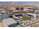 An aerial view displays the Las Vegas Ballpark and the surrounding Summerlin community with mountain views at 10448 Niagara Falls Ln, Las Vegas, NV 89144
