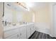 Bright bathroom features a soaking tub, double vanity, and tiled flooring at 10448 Niagara Falls Ln, Las Vegas, NV 89144