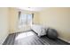 Bedroom with lots of natural light and grey wood-look flooring at 10448 Niagara Falls Ln, Las Vegas, NV 89144