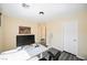 Well-lit bedroom features modern gray wood floors, fresh paint, and space for a desk or office at 10448 Niagara Falls Ln, Las Vegas, NV 89144