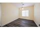 Dining room with wood-look floors and a window providing natural light at 10448 Niagara Falls Ln, Las Vegas, NV 89144
