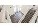 Open entryway with wood-look floors, high ceilings, and staircase to the second floor at 10448 Niagara Falls Ln, Las Vegas, NV 89144