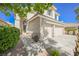 Charming stucco home featuring a 3-car garage and inviting front entrance at 10448 Niagara Falls Ln, Las Vegas, NV 89144