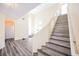 Foyer with staircase, wood-look floors, and natural light at 10448 Niagara Falls Ln, Las Vegas, NV 89144