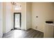 Bright foyer features wood-look floors, a decorative glass front door, and a chandelier at 10448 Niagara Falls Ln, Las Vegas, NV 89144