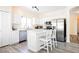 Contemporary kitchen with stainless appliances, a large island with seating, and ample cabinet space at 10448 Niagara Falls Ln, Las Vegas, NV 89144