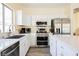 Modern kitchen with stainless steel appliances, ample counter space, and sleek cabinetry at 10448 Niagara Falls Ln, Las Vegas, NV 89144