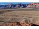 Stunning aerial view captures the vastness and beauty of the Red Rock Canyon landscape at 10448 Niagara Falls Ln, Las Vegas, NV 89144