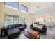 Bright living room features wood-look floors and access to the backyard pool at 10448 Niagara Falls Ln, Las Vegas, NV 89144