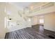 Spacious living room features soaring ceilings, large windows, and contemporary wood-look floors at 10448 Niagara Falls Ln, Las Vegas, NV 89144