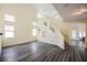 Open living space with staircase, display niches, and wood-look floors at 10448 Niagara Falls Ln, Las Vegas, NV 89144