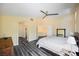 Cozy bedroom with neutral paint, archway, and access to the upstairs living space at 10448 Niagara Falls Ln, Las Vegas, NV 89144
